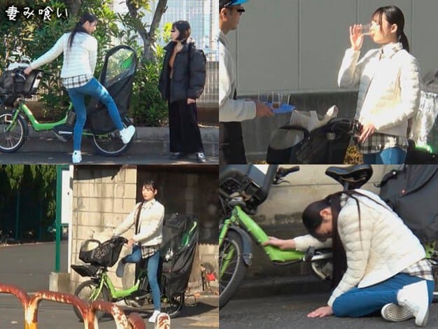白いダウン姿の女性が緑の子乗せ自転車にまたがり、路上で頭を下げる